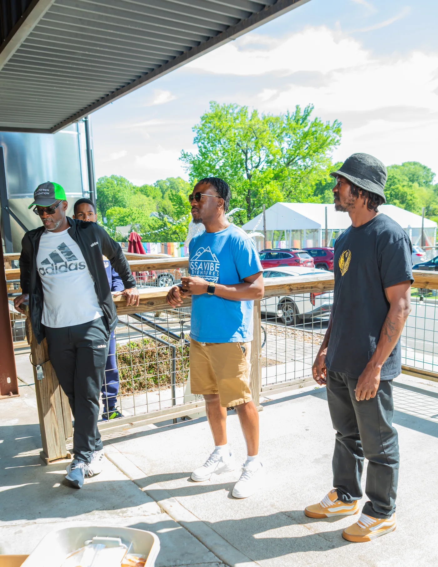 Manna House members talking together outside during a community gathering