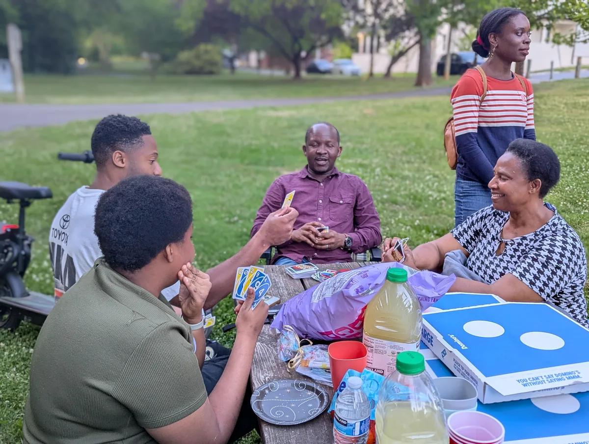 Manna House members sharing a meal together